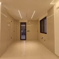 Interior corridor in warm light, finished and ready for handover